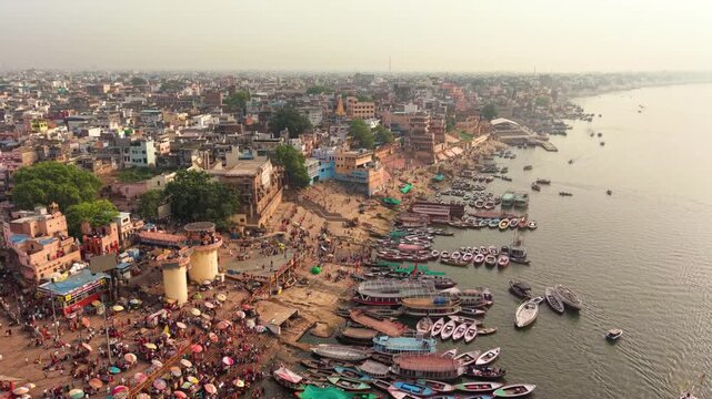 Varanasi, India: Aerial view of famous Dashashwamedh Ghat in ancient holy city on Ganges river - landscape panorama of Southeast Asia from above
