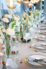 Wedding table setting with white flowers