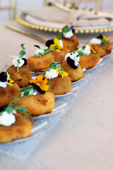 Gourmet appetizers decorated with edible flowers