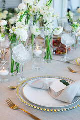 Wedding table setting with white flowers