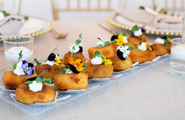 Gourmet appetizers decorated with edible flowers