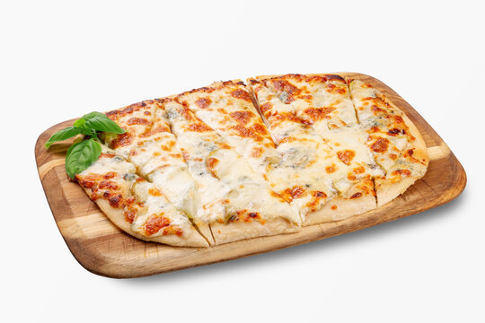 Italian four cheese pizza sliced and served on a wooden board with fresh basil, melted mozzarella and dorblu, classic cheesy pizza for menu or delivery, close up, isolated