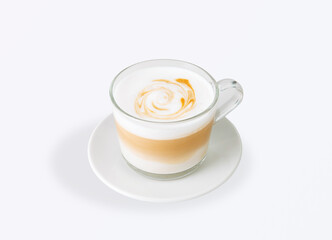 Fresh cappuccino served in a transparent glass cup on a white saucer, with creamy milk foam and delicate latte art swirl, minimal style