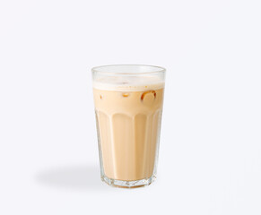 Iced latte served in a transparent glass with creamy milk, espresso, ice cubes, and froth on top, perfect for summer and refreshing moments