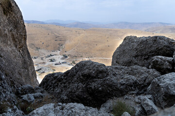 Stones of an ancient village in the vicinity of Mount Beshbarmak. Baku. Azerbaijan.