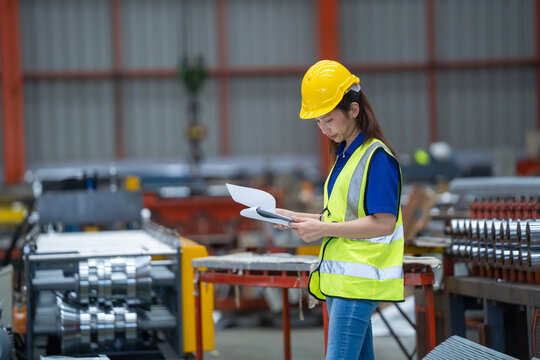 Safety inspection industrial warehouse document review manufacturing facility close-up compliance check