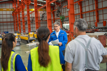 Workshop training session industrial facility group discussion manufacturing environment educational viewpoint team building concept