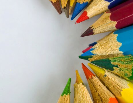 Colored pencils arranged in a circle on a light background.  Close-up