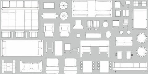 Top down view of various furniture pieces arranged on a grey background for interior design planning