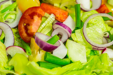 fresh lunch salad ring red onion lettuce tomatoes in a metal full bowl closeup useful snack diet