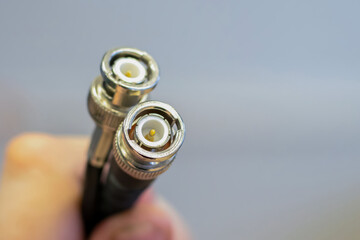 coaxil wire two outputs in the hands close-up