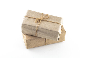 giftbox in natural craft paper on an isolated background, birthday gift