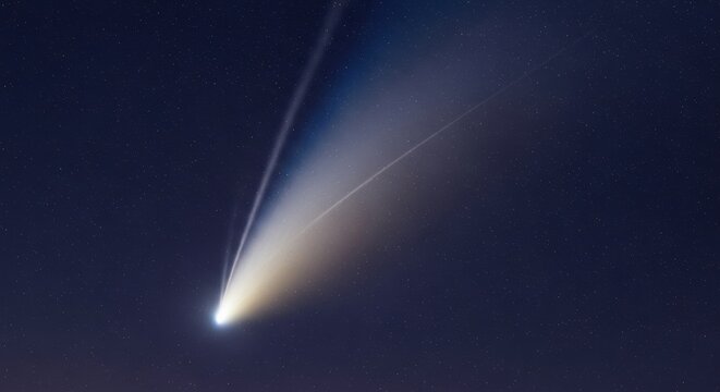 A majestic comet with a bright glowing nucleus and a long dust tail streaming across a starry night sky. Detailed astrophotography of a celestial object in deep space.