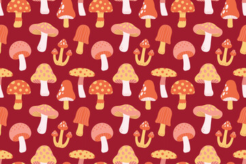 Seamless autumn mushroom pattern in orange, yellow, pink, and white tones on red background. Great for seasonal crafts and design.