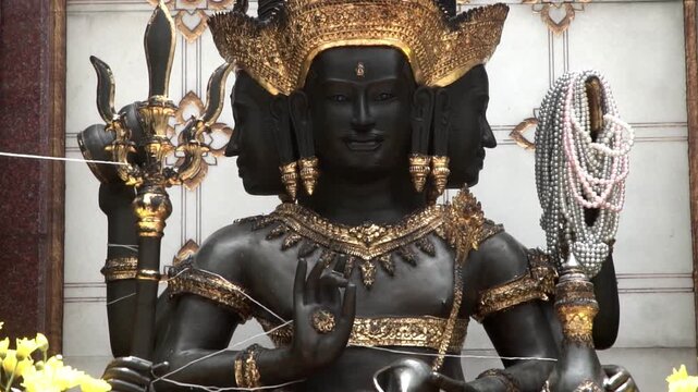 Trimurati statue, Hindu god statue in temple.	