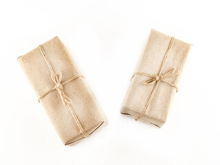 Two brown boxes with a string tied to them