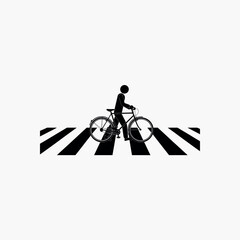 Black silhouette of person riding bicycle across white and black striped crosswalk cycling pedestrian crossing