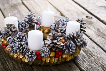 traditional advent wreath on weathered old wood table background
