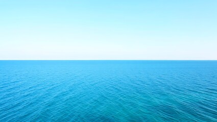 Fototapeta premium Vast blue ocean horizon under a clear sky