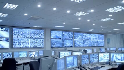 Security Control Room Monitoring Displays With Live Surveillance Feeds. - Powered by Adobe