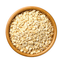 A wooden bowl filled with whole grain rolled oats