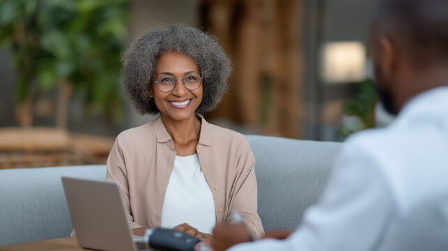 Telemedicine Consultation: A patient on a video call with a doctor with a laptop a blood pressure monitor and a cozy home office setting. high quality photo ultra high detail