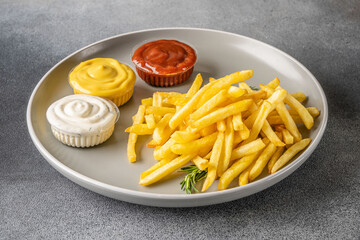 French fries with sauces on plate