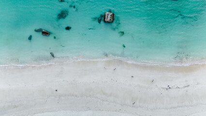 Explore the pristine beaches of Mannen Haukland in Lofoten, Norway, where azure waters meet soft...