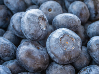 Pile of fresh blueberries, closeup, natural sweet fruit for healthy eating concept.
