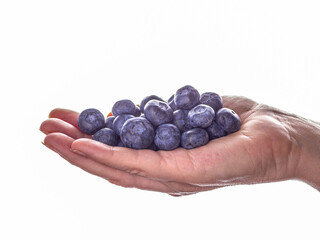 Handful of fresh blueberries, summer harvest, healthy eating lifestyle background.
