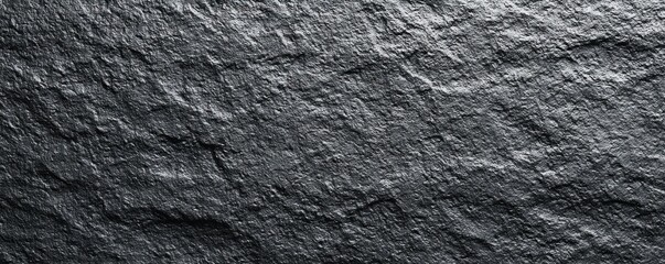 Black or dark gray rough grainy stone texture background. MZ 