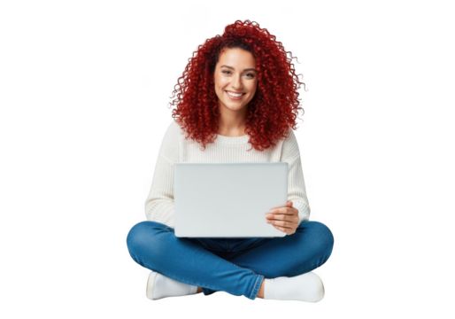 Woman with red curly hair sitting cross legged with a laptop isolated on transparent background