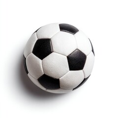 Classic Soccer Ball. A white and black patterned soccer ball sits angled on a clean, stark white surface, casting a soft shadow from upper left