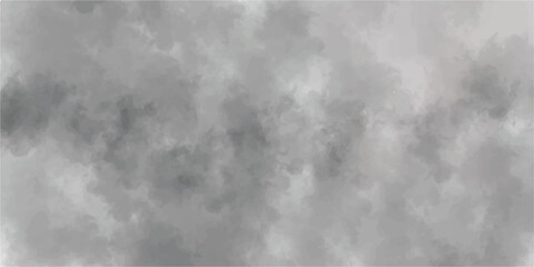 An abstract image of black and white smoke clouds on a dark sky	