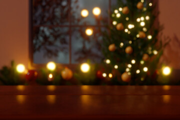 Christmas tree with glowing lights and decorations by a window at night. 3d rendering