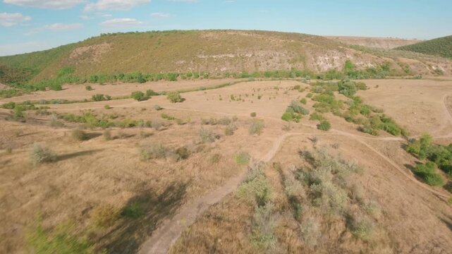 FPV drone aerial shot. Mountain views of nature landscape of the Moldavian National Park, Furceni Village, Moldova, Europe