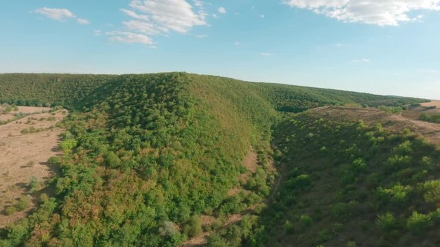 FPV drone aerial shot. Mountain views of nature landscape of the Moldavian National Park, Furceni Village, Moldova, Europe