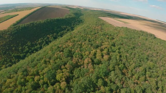 FPV drone aerial shot. Mountain views of nature landscape of the Moldavian National Park, Furceni Village, Moldova, Europe