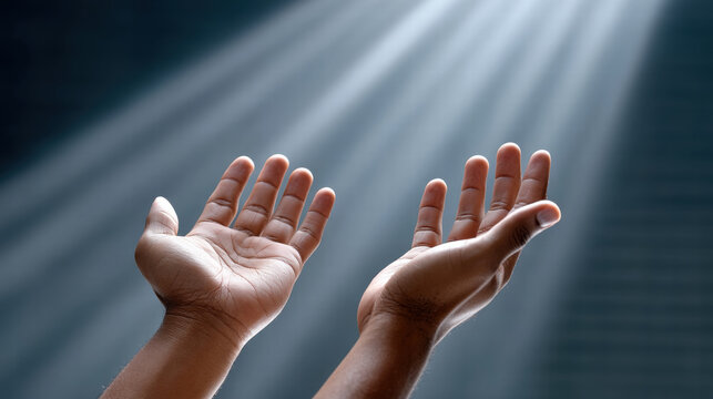 Ray of hope used in motivational poster showing open hands reaching upward in dramatic light symbolizing faith and aspiration - Powered by Adobe