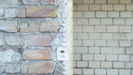 Old wall made of yellowish rectangular bricks