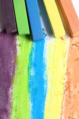 Colorful chalk pastels on white background, flat lay