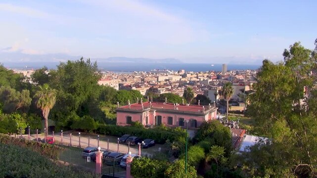 Royal residence on Capodimonte hilltop commissioned by Bourbons of Naples. Panorama of the Gulf of Napoli that people enjoy from the Neapolitan park of Capodimonte, Naples, Italy.