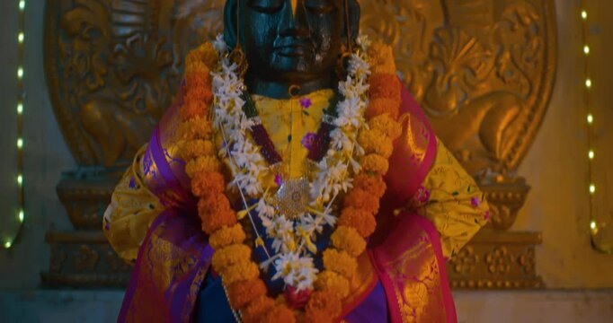 Sacred black stone idol of Lord Vitthal in the temple sanctum, radiating devotion and spirituality, symbolizing the essence of Hindu culture and divine faith