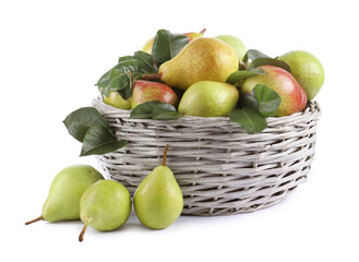 Fresh ripe pears with green leaves in wicker basket isolated on white