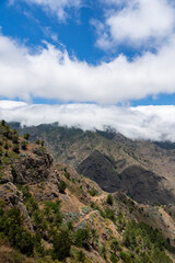 Clouds embracing the volcanic landscape of la palma, canary islands