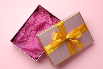 Open gift box with beautiful lid on pink background, top view