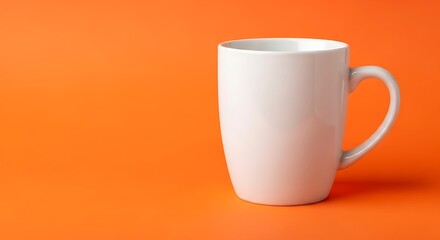 White coffee mug on a bright orange background