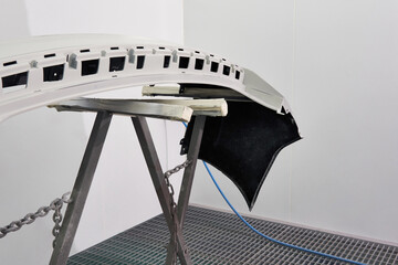 Car element body after painting. Drying parts of the automobile in spray booth.