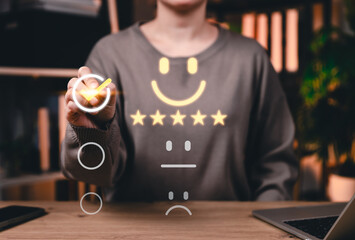 Customer satisfaction concept. Person selecting five-star rating with smiling face icon...