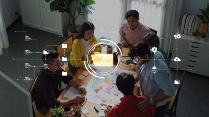 A diverse group of professionals engage in a collaborative brainstorming session in a modern office, surrounded by sticky notes and a digital interface, fostering innovation. Raster